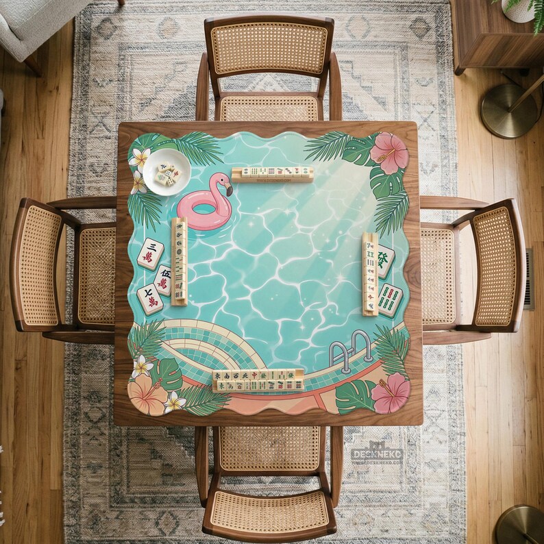 May include: A square wooden mahjong table with a pool-themed design, surrounded by four rattan chairs. The table features a turquoise pool graphic with a pink flamingo floatie, tropical flowers, and mahjong tiles. The table is approximately 48 inches square.