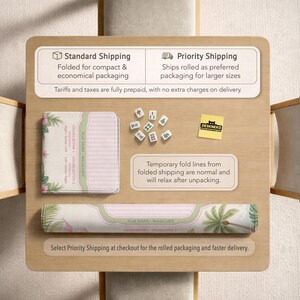 May include: A mahjong mat featuring a light pink and green tropical palm leaf design, displayed in both folded and rolled formats. The mat includes text labels for Charleston 1 and 2, and Play Right Walls Left. Nine small white mahjong tiles are included.