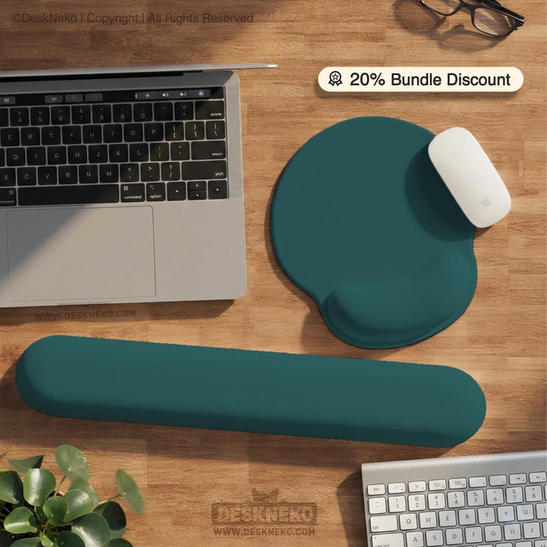 May include: A teal ergonomic mouse pad and wrist rest set. A white mouse sits on the pad. A laptop and keyboard are also visible. The image includes the text "20% Bundle Discount" and "DeskNeko".