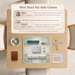 May include: A Mahjong set on a light wood table with a game mat featuring bamboo illustrations. Includes a small bowl of green marbles, a brown notebook, a wooden tile rack, and a score sheet. A sign displays Mini Sizes For Solo Games with 15.7 inch and 20.9 inch options.
