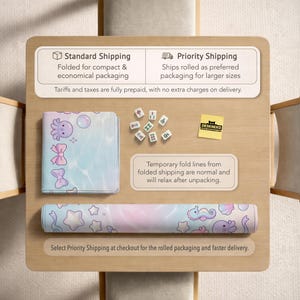 May include: A rolled and folded desk mat with a pastel aquatic design featuring sea creatures and stars. The folded mat shows an octopus, bows, and bubbles. The image also shows mahjong tiles and a "DESKNEKO" sticker.