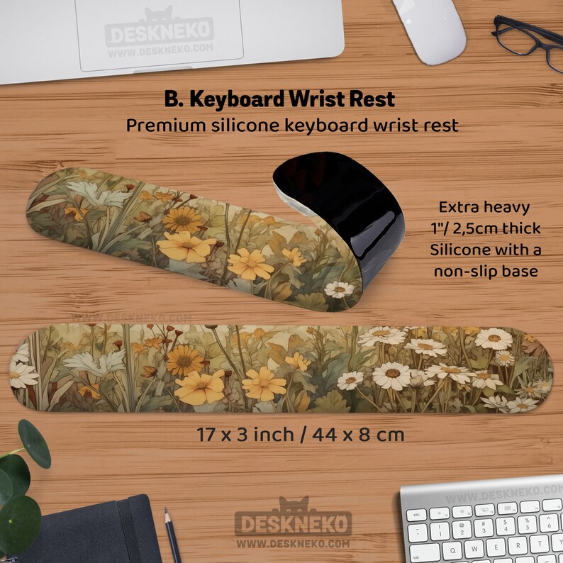 May include: A premium silicone keyboard wrist rest with a floral design. The wrist rest is 44 x 8 cm and 2.5 cm thick. The design features yellow and white flowers with green foliage. The product has a non-slip base.