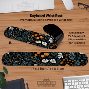May include: A black keyboard wrist rest with a floral pattern featuring white, yellow, and teal flowers. The wrist rest is 17 x 3 inches and 1 inch thick, made of silicone with a non-slip base. The text on the image says "Keyboard Wrist Rest".