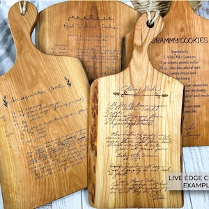 Live edge cherry cutting board that's engraved with a handwritten recipe. Engraving is done in the handwriting of the person who wrote it.