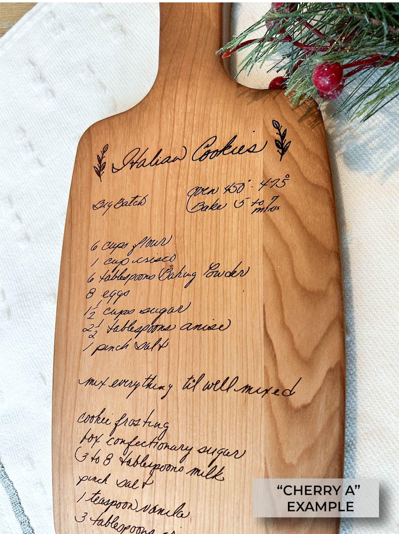 Small cherry cutting board with handwritten recipe engraved on it. Family recipe engraved on cutting board.