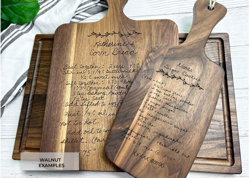 Engraved recipe cutting boards engraved on walnut wood or various sizes. Designs above titles.