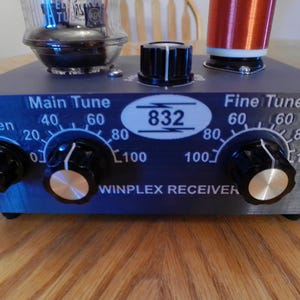 May include: A dark blue WINPLEX RECEIVER with multiple dials and knobs. The front panel has the text "Main Tune", "Fine Tune", and "Regen". The center has the number "832" in a white oval.