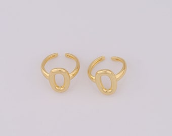 May include: Two gold-toned rings with a simple oval shape. The rings are adjustable and can be worn on any finger.