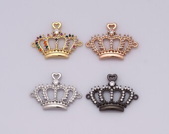 May include: Four crown-shaped charms with clear and colorful rhinestones. The charms are gold, rose gold, silver, and black.