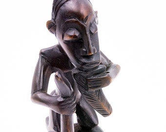 Staffa per puleggia da telaio Baoulé decorata con personaggio a figura intera (rara)