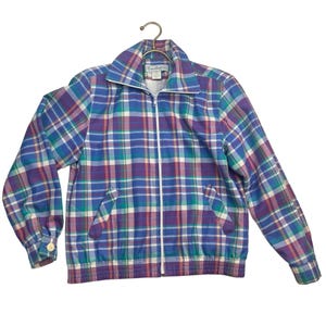 May include: A blue, green, pink, and white plaid jacket with a zipper closure. The jacket has a stand-up collar and a pocket on the left side.