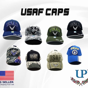 May include: A collection of eight baseball caps with different camouflage and solid color designs. Each cap features the text "USAF" and a US Air Force emblem. The caps are arranged in two rows of four.