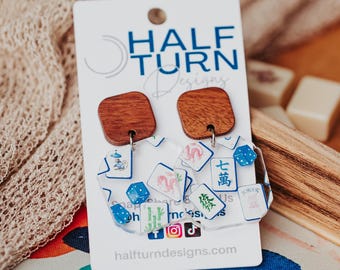 Mahjong earrings featuring mahjong tiles with a blue Chinoiserie-inspired design