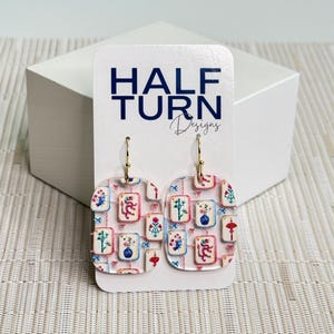 Lightweight mahjong earrings with mixed tile illustrations designed for everyday wear by Half Turn Designs