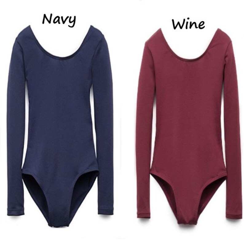 May include: Two long-sleeved leotards, one navy blue and one wine red. Both have a scoop neck and are made of a stretchy fabric.