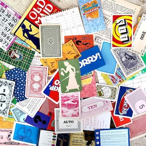 May include: A collection of vintage game cards and game pieces, including playing cards, bingo cards, and game instructions. The cards feature various designs, colors, and text, such as "Old Maid," "Sorry!," and "Family Charades."