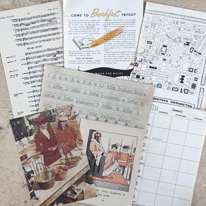 Puede incluir: Una colecci&oacute;n de ef&iacute;meras vintage, que incluye partituras, un mapa del centro de Washington, un calendario y una p&aacute;gina manuscrita con el texto "little Indian boys". Tambi&eacute;n incluye una ilustraci&oacute;n vintage y un folleto.