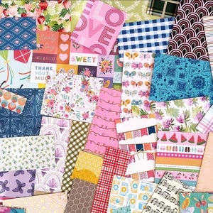 May include: A collage of patterned paper sheets in various colors and designs. Pink, blue, and green are prominent, with floral, geometric, and text-based patterns. Some sheets have text that reads "LOVE" and "SWEET".