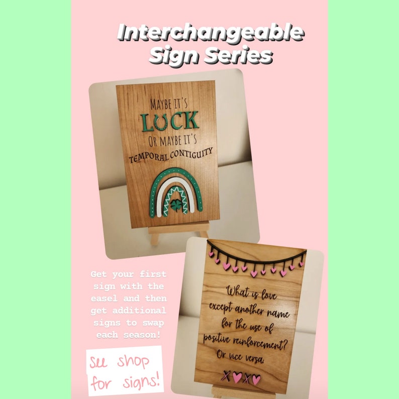 May include: Wooden signs with text and decorative elements. One sign reads "Maybe it's luck or maybe it's temporal contiguity" with a rainbow and shamrock. The other sign says "What is love except another name for the use of positive reinforcement?"
