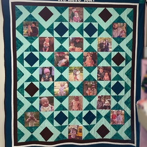 May include: A teal and brown quilt with a diamond pattern. Each diamond contains a photo of a family. The quilt has a white border and the words "We Love You!" are written in white on the top of the quilt.
