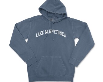 May include: A blue hooded sweatshirt with the text "LAKE MINNETONKA" in white lettering.