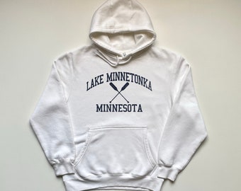 May include: White hooded sweatshirt with a navy blue graphic print that says "Lake Minnetonka Minnesota" with two crossed oars.