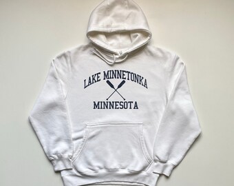 May include: White hooded sweatshirt with a navy blue graphic print that says "Lake Minnetonka Minnesota" with two crossed oars.