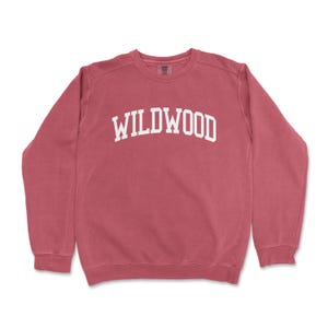 a red sweatshirt with the word wildwood printed on it