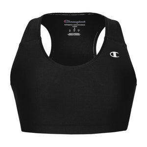 May include: Black sports bra with a racerback design and a Champion logo on the right strap. The tag reads "Champion Authentic Athleticwear".
