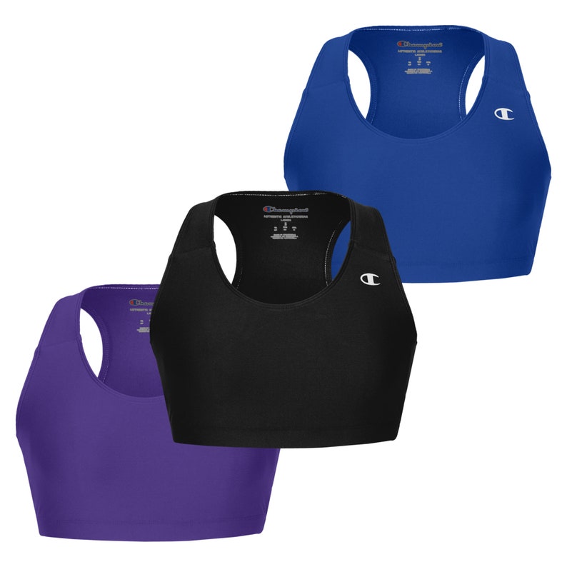 May include: Three sports bras in different colours: purple, black, and blue. Each bra has a Champion logo on the front.
