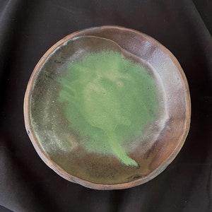 Handmade rustic stoneware bowl with carved exterior