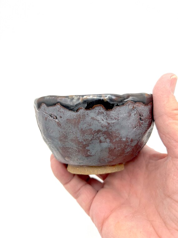 Rustic handmade stoneware tea bowl