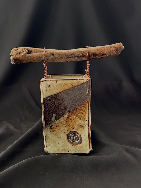 Handmade pottery stoneware vase with driftwood and spiral medallion