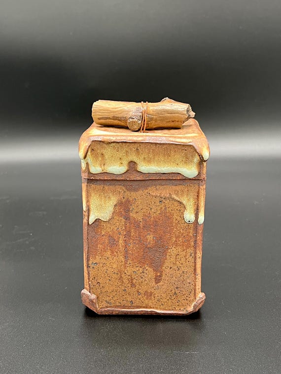 Tall handmade rustic pottery stoneware box with driftwood accent