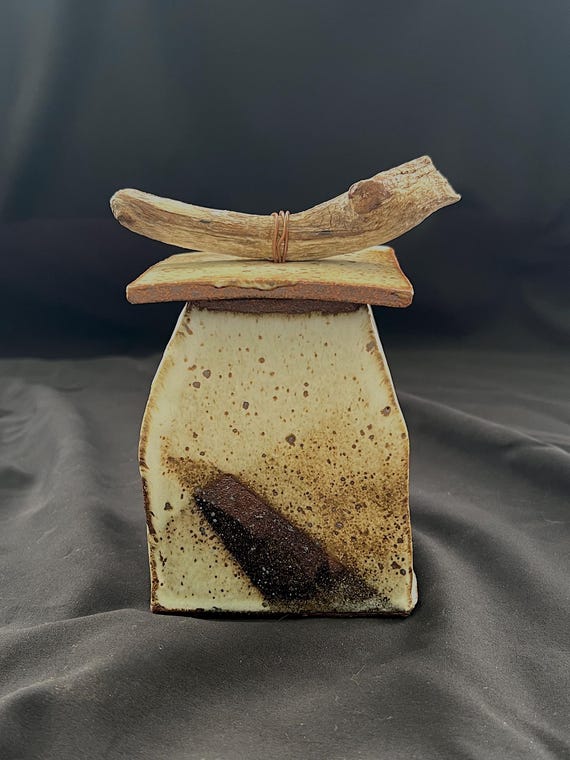 Handmade rustic pottery stoneware box with driftwood