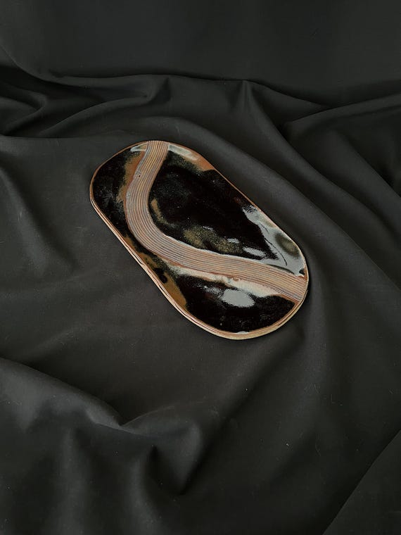 Rustic handmade oval stoneware platter with carved detail