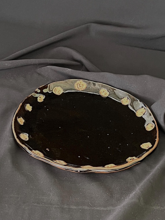 Rustic freeform handmade black stoneware platter with spiral details