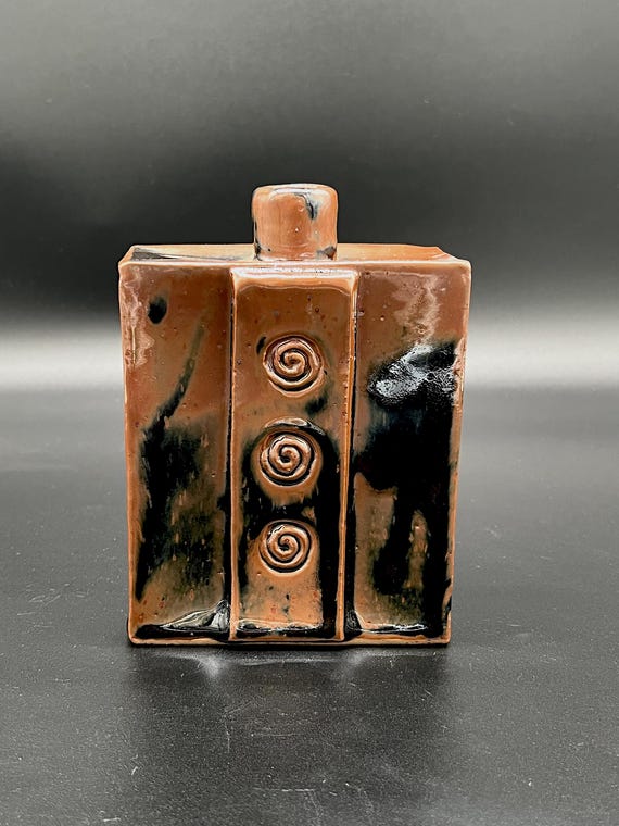Rustic handmade stoneware vase with spiral detail