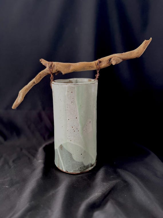 Large handmade pottery stoneware vase with driftwood