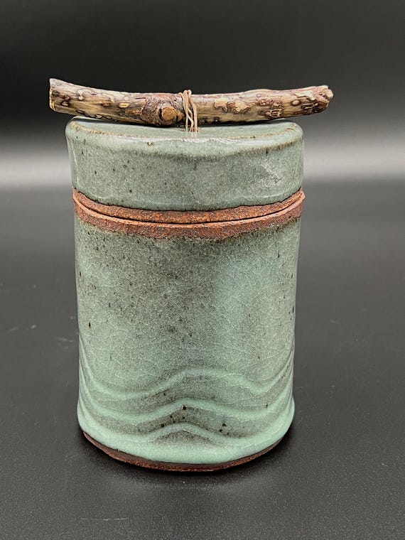Tall handmade rustic pottery stoneware box with driftwood accent