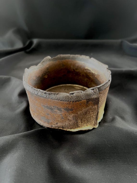 Small handmade stoneware bowl with ripped edge detail
