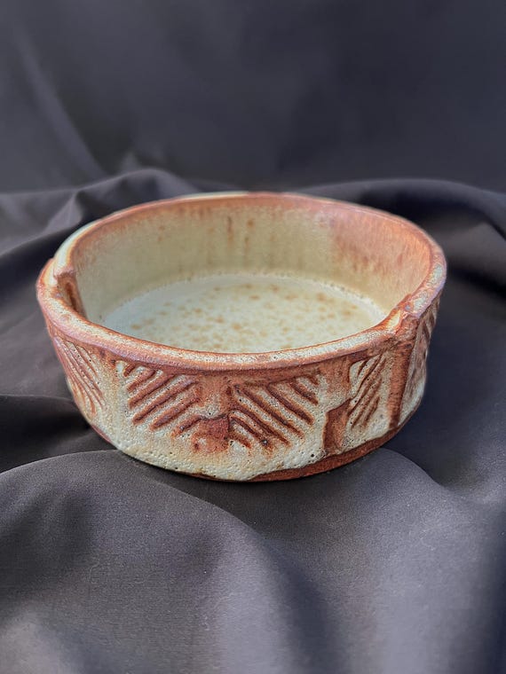 Round handmade stoneware bowl with geometric detail