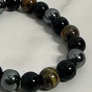Armband tijgeroog, hematiet en zwart obsidiaankristal 10 mm