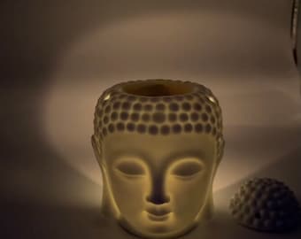 Cabeza de vidrio derretido de vela de Buda