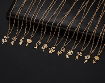 May include: A set of 12 gold-toned necklaces with delicate flower pendants. Each necklace features a different flower design, including a rose, daisy, and other floral motifs.