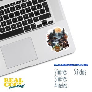 May include: A sticker featuring a watercolor illustration of a forest scene with a waterfall, trees, and a sunset. The sticker has the text "Woodrow Canyon Wilderness" in a brown rectangle with a white border.
