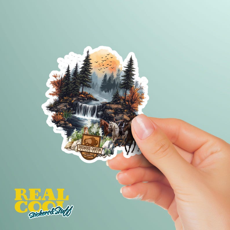 May include: A sticker featuring a watercolor illustration of a waterfall in a forest with a sunset in the background. The sticker also includes a sign that reads "Dogwood Canyon Nature Park".