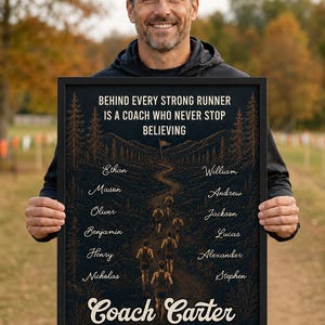 May include: A framed rectangular poster with a black background featuring the text BEHIND EVERY STRONG RUNNER IS A COACH WHO NEVER STOP BELIEVING, a graphic of runners on a trail, twelve names, Coach Carter, and RIVERBROOKE COUNTRY CROSS 2026-2027.