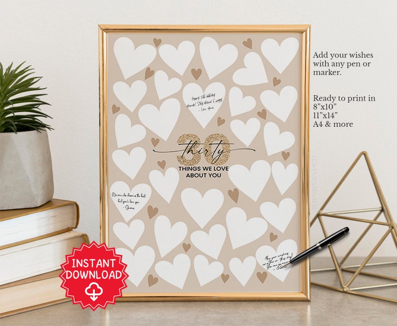 May include: Printable 30th birthday sign with gold glitter text that says "Thirty Things We Love About You". The sign features a beige background with white hearts that can be filled in with messages.