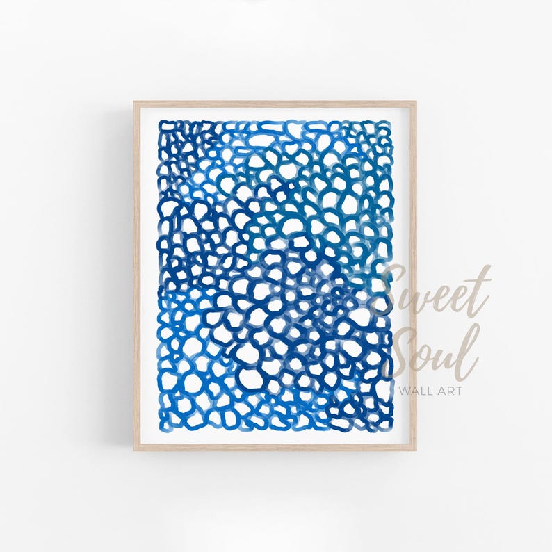 May include: Abstract watercolour painting in shades of blue, featuring a pattern of overlapping circles. The artwork is framed in a light wood frame.